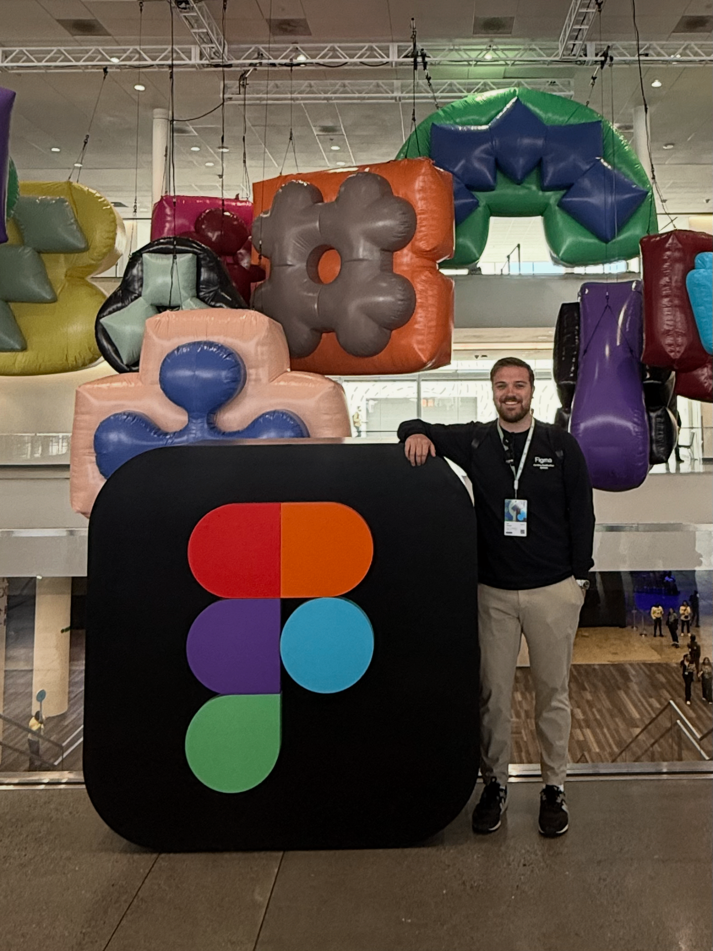 Mark standing next to a giant Figma logo at Config 2025
